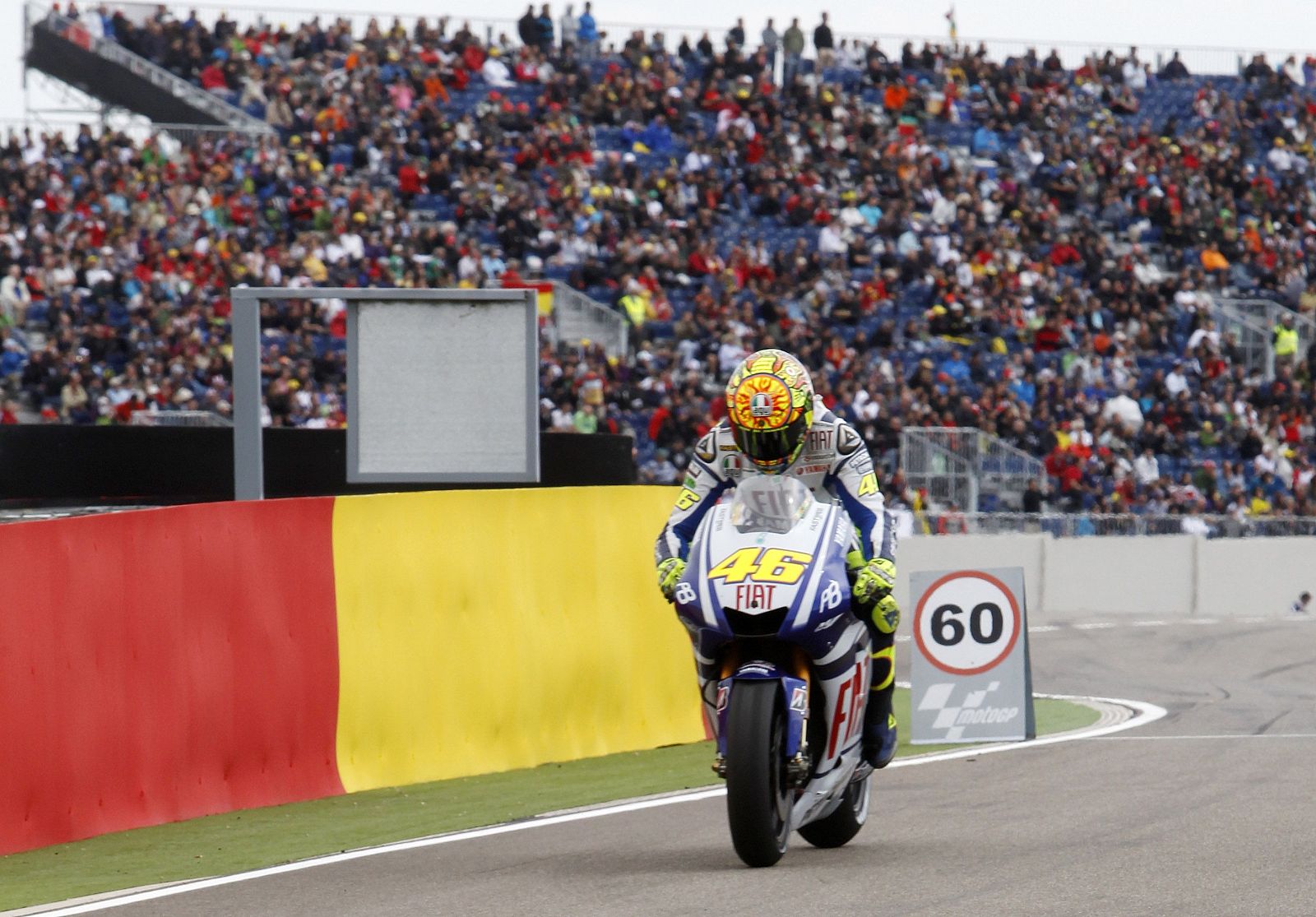 Yamaha MotoGP rider Valentino Rossi of Italy arrives at the pit after taking the seventh position in the Aragon Grand Prix at Motorland racetrack in Alcaniz,