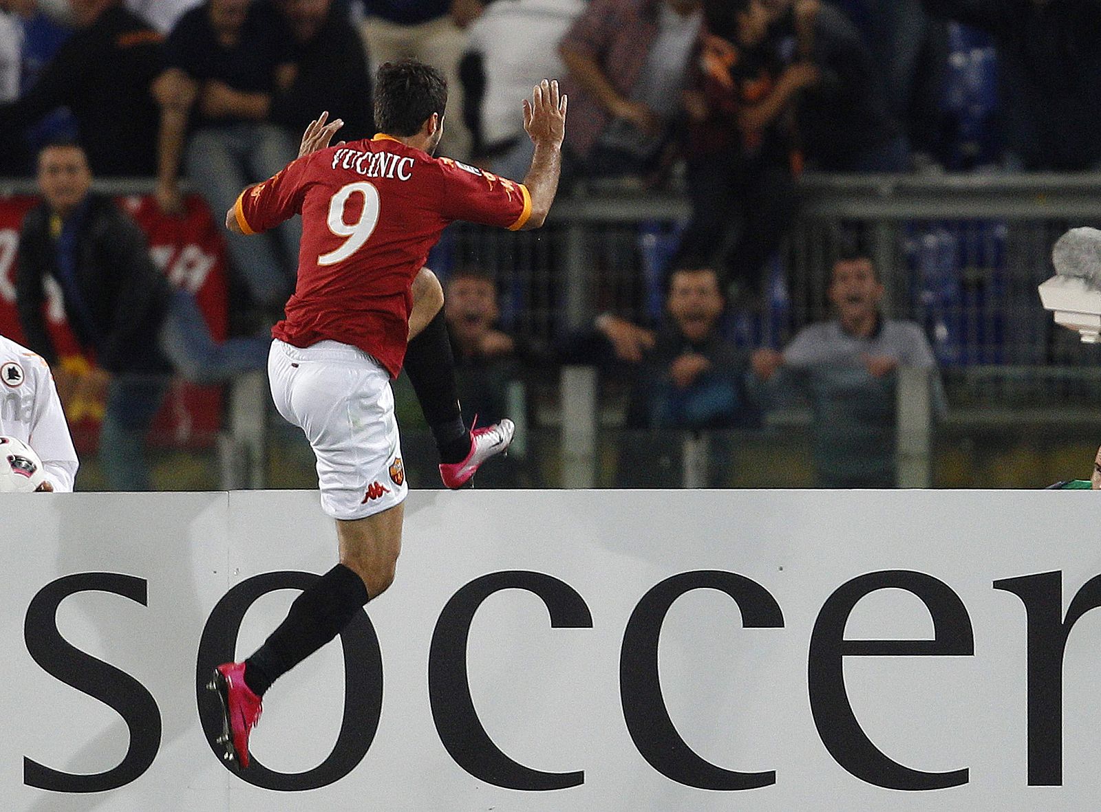 AS Roma's Mirko Vucinic celebrates after scoring against Inter Milan during their Italian Serie A soccer match in Rome