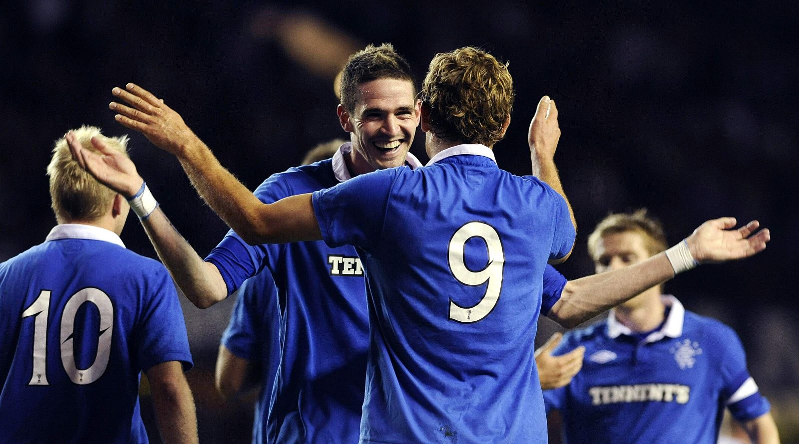 Rangers' Lafferty congratulates teammate Jelvic on his second goal against Dunfermline during their Scottish League Cup soccer match at Ibrox Stadium in Glasgow
