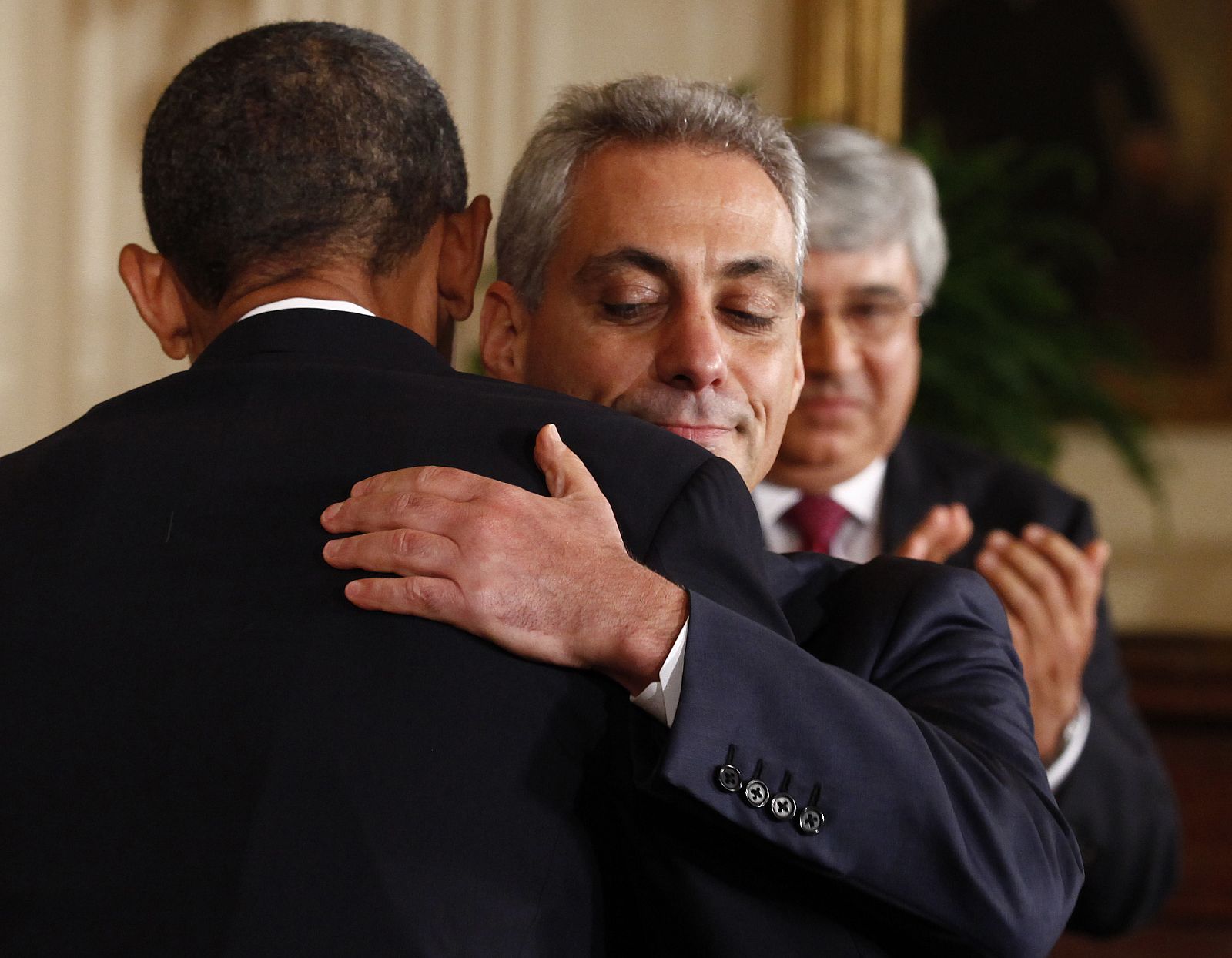 U.S. President Obama hugs outgoing White House Chief of Staff Emanuel in Washington