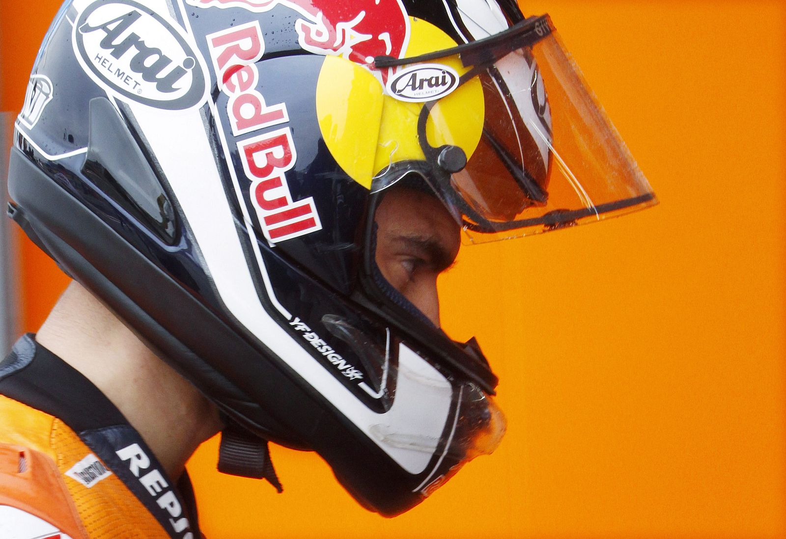 Honda MotoGP rider Dani Pedrosa of Spain looks at his bike during second free practice of the Aragon Grand Prix at Motorland race track in Alcaniz