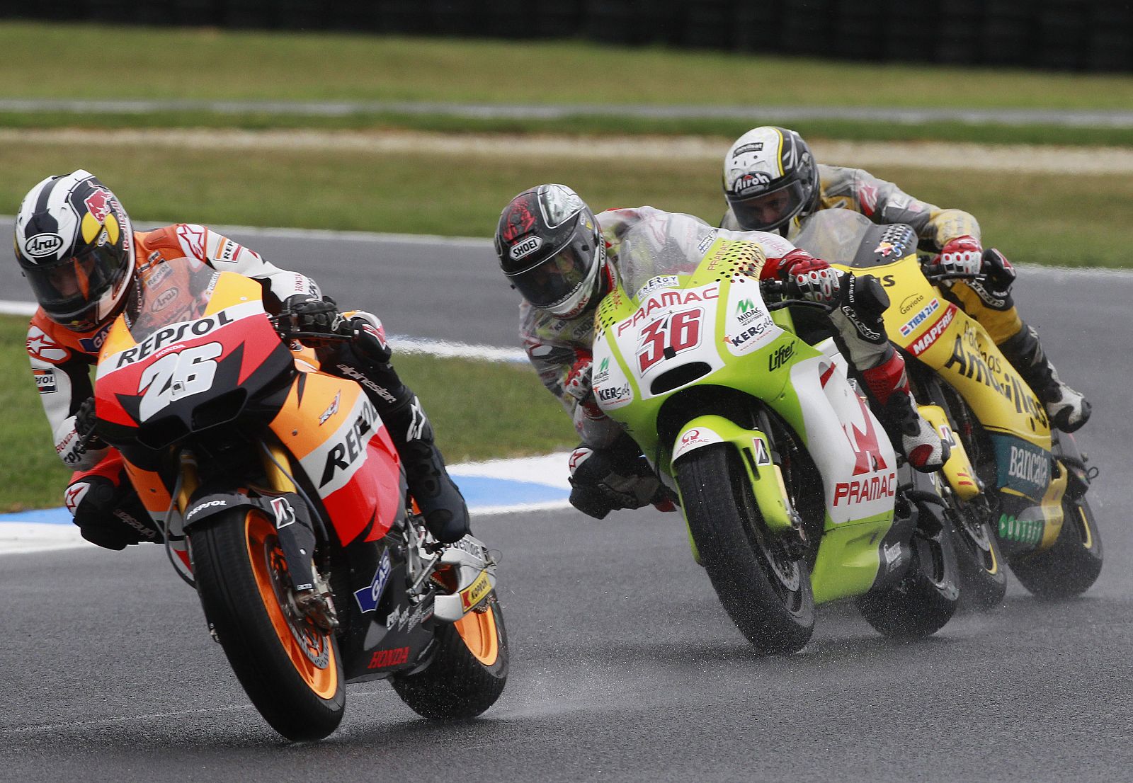 Honda MotoGP rider Pedrosa of Spain leads Ducati rider Kallo of Finland and Ducati rider Barbera of Spain during the first practice session of the Australian Grand Prix in Phillip Island