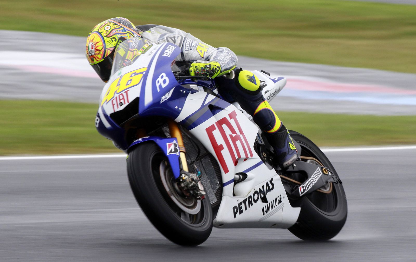 Yamaha MotoGP rider Rossi of Italy takes a corner during the first practice session of the Australian Grand Prix in Phillip Island