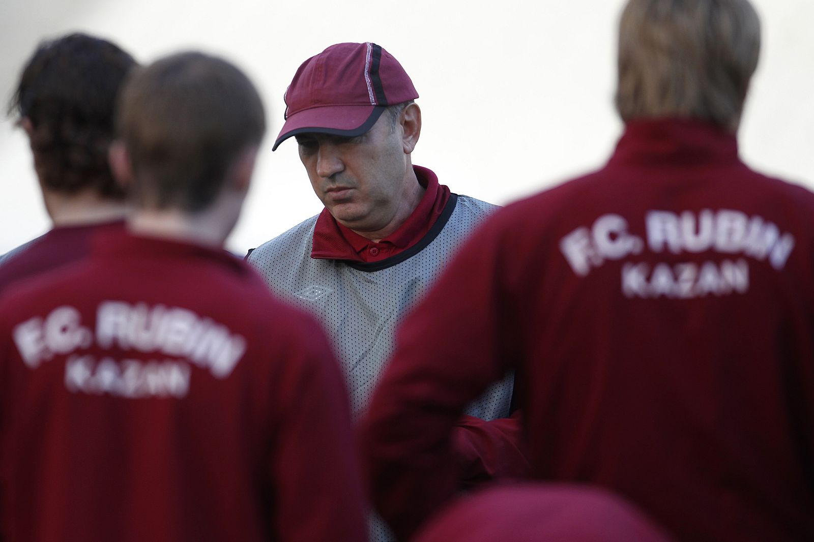 FC Rubin Kazan's coach Kurban Berdyev talks to his players during a training session at Olympic stadium in Athens