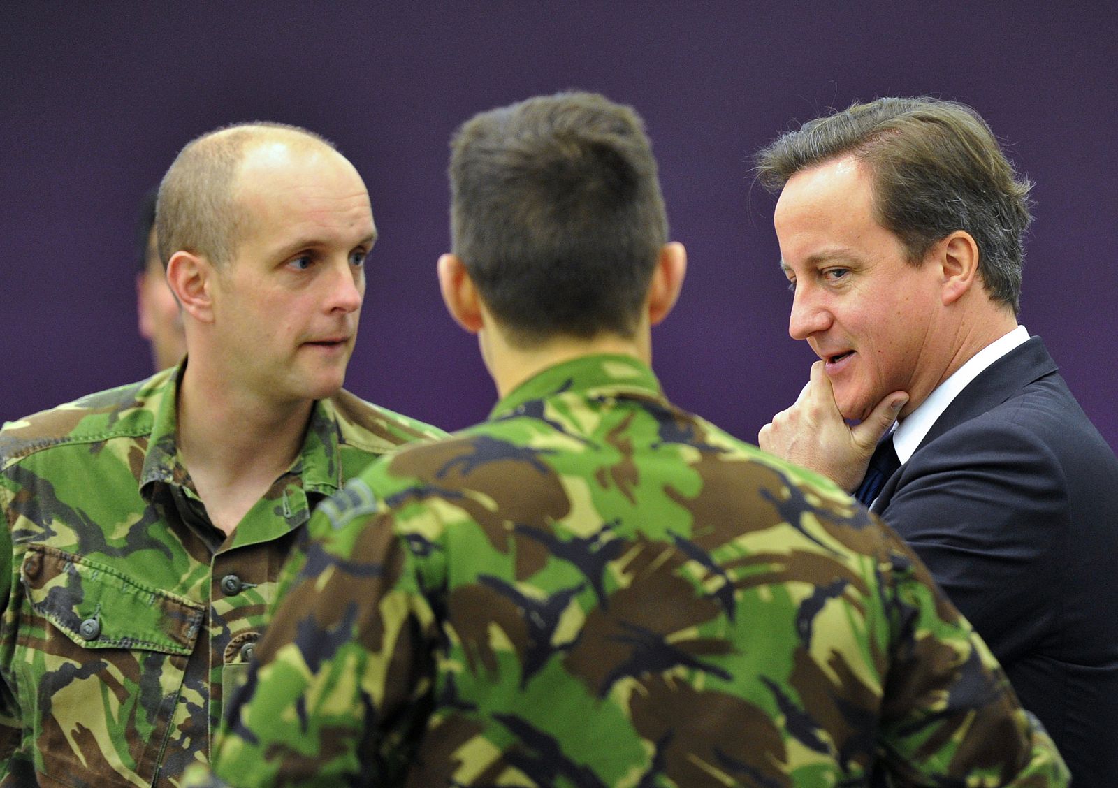 Britain's PM Cameron speaks with personnel at The Permanent Joint Headquarters in Northwood