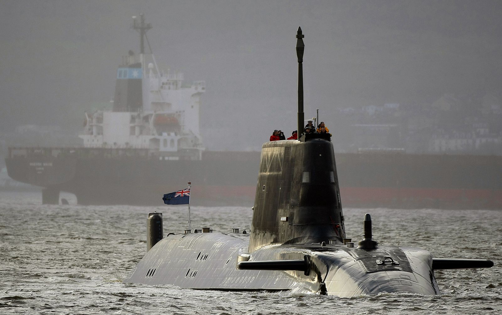 HMS Astute sails into the River Clyde and up the Gareloch to her new home at HM Naval Base Clyde in Faslane near Glasgow, Scotland