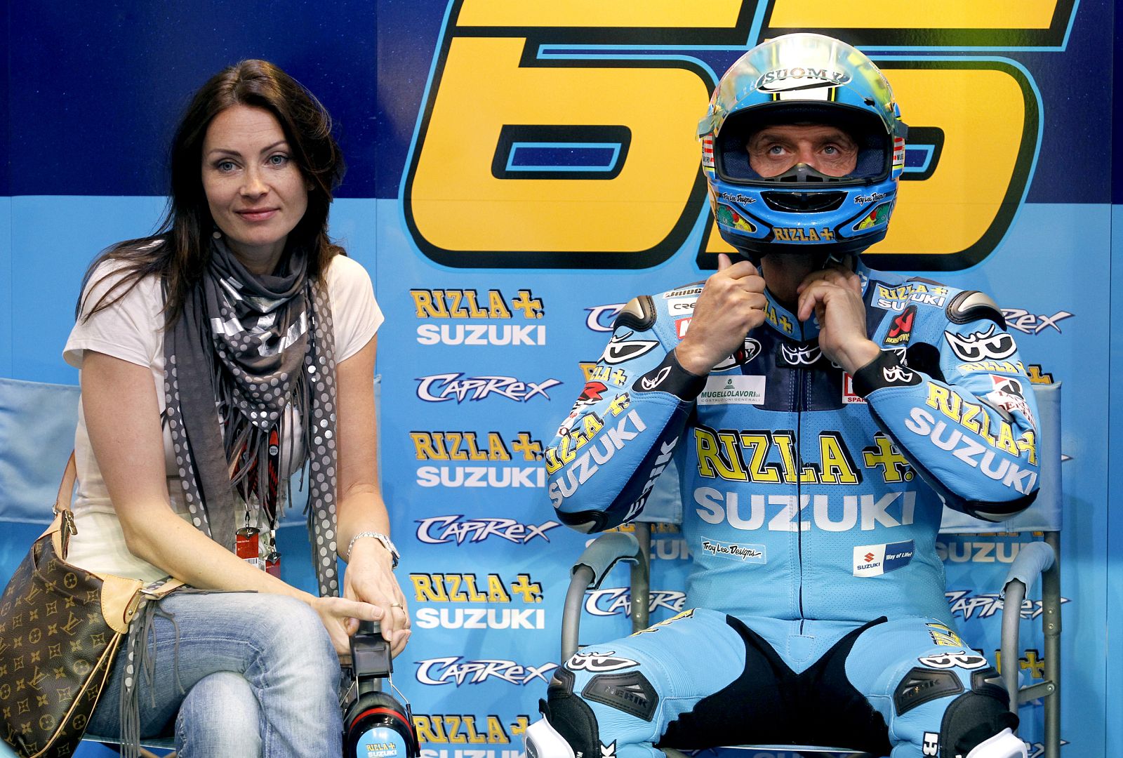 Suzuki MotoGP rider Capirossi of Italy sits in his team box before a race at the MotoGP World Championship in Doha