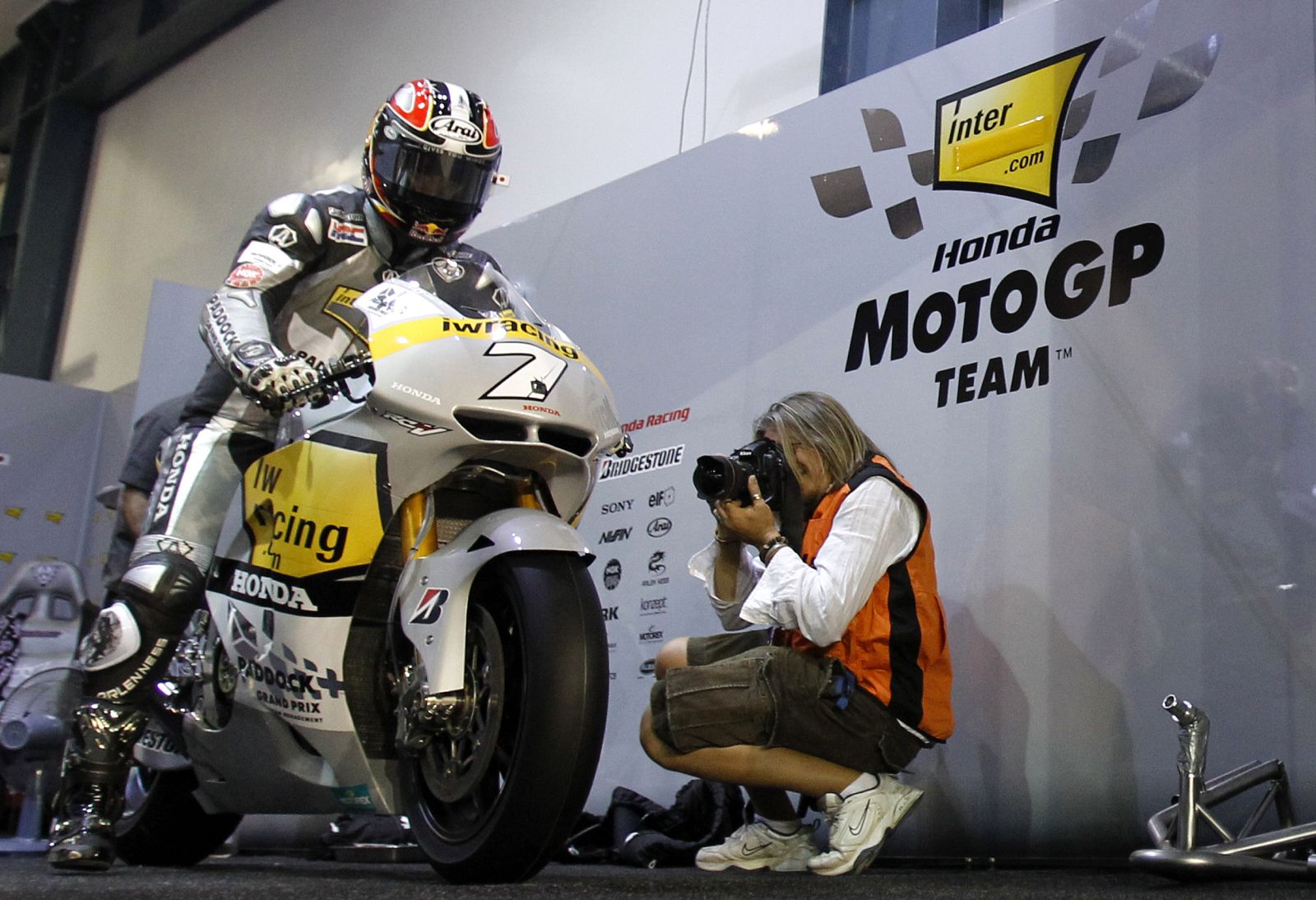 Honda MotoGP rider Aoyama of Japan sits on his motorcycle before a race at the MotoGP World Championship in Doha