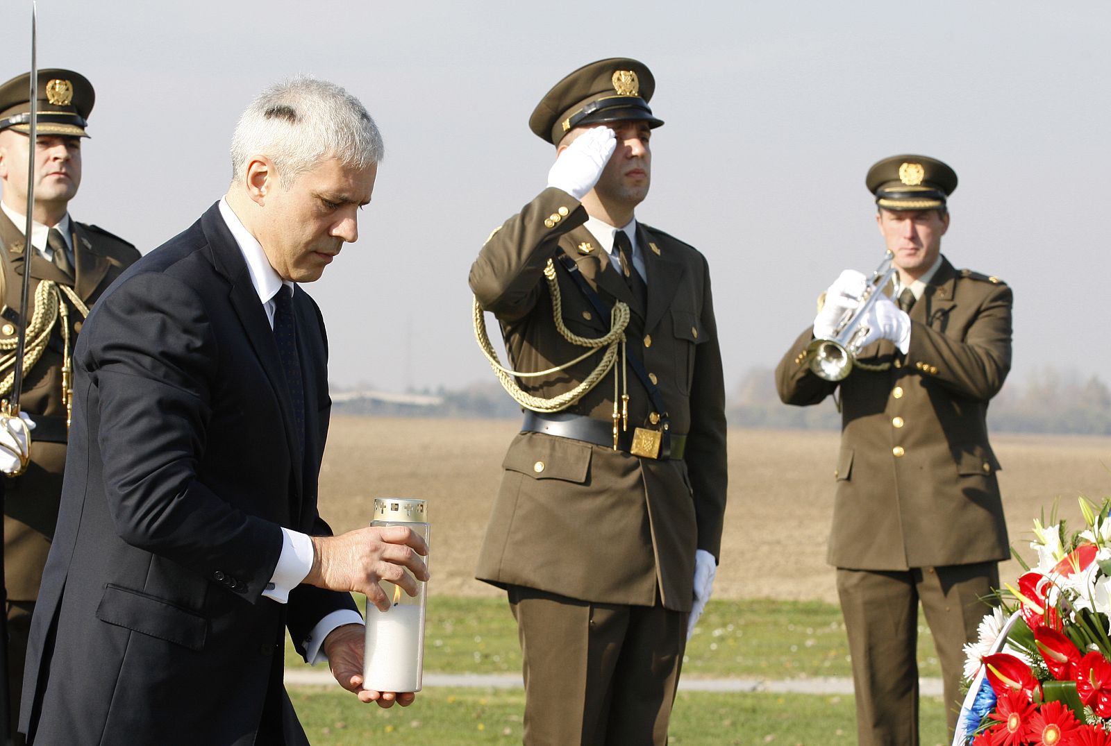 Serbia's President Tadic pays his respects to more than 200 victims killed by Belgrade led troops in 1991 at Ovacara mass grave site near Vukovar