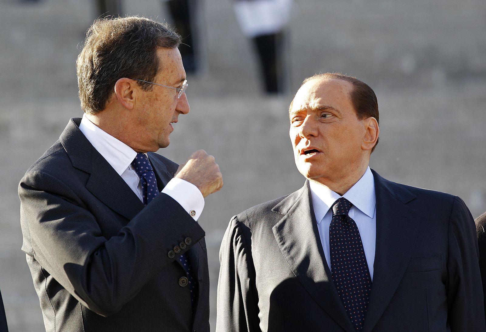 Italian Prime Minister Berlusconi and Italy's lower house speaker Fini talk as they attend the celebration of the Italian Army's anniversary in Rome
