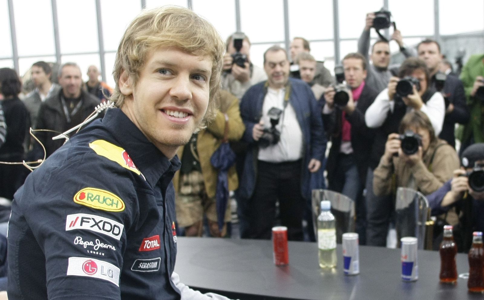 Red Bull Formula One driver Vettel looks on during a press conference at Hangar 7 in Salzburg