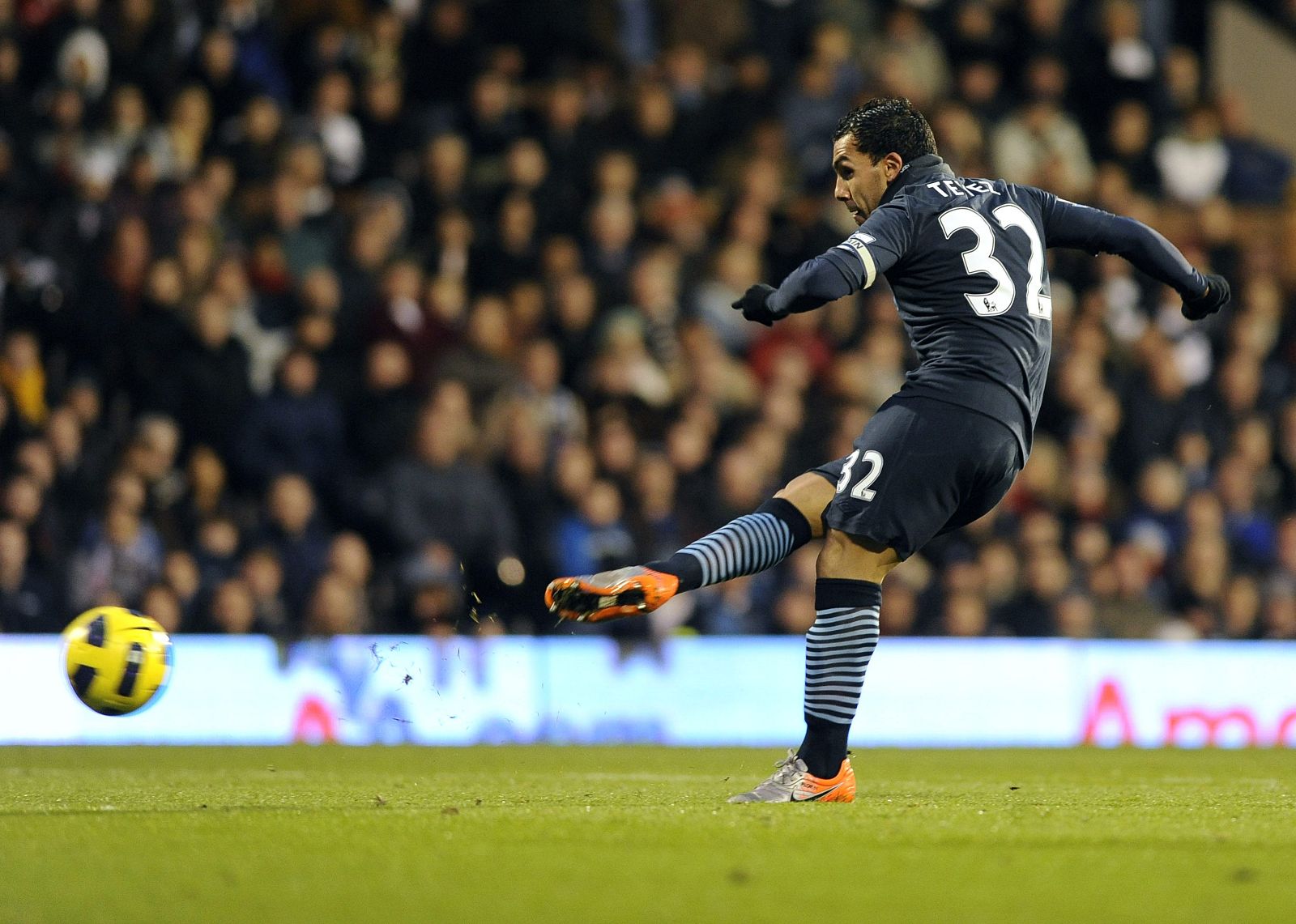 Manchester City's Tevez scores against Fulham during their English Premier League soccer match at Craven Cottage