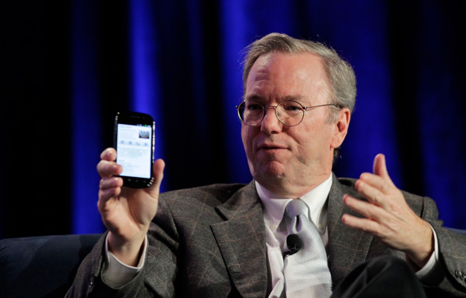 Google CEO Eric Schmidt holds a prototype of the Android Gingerbread smartphone during the Web 2.0 Summit in San Francisco