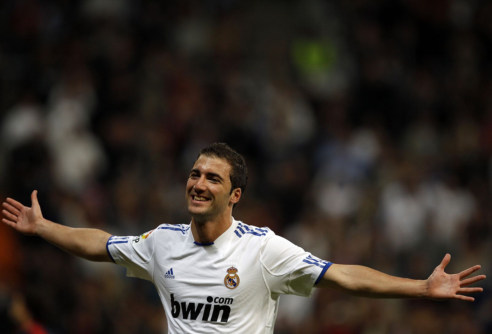 Real Madrid's Higuain celebrates his goal against Racing Santander during their Spanish First Division soccer match in Madrid
