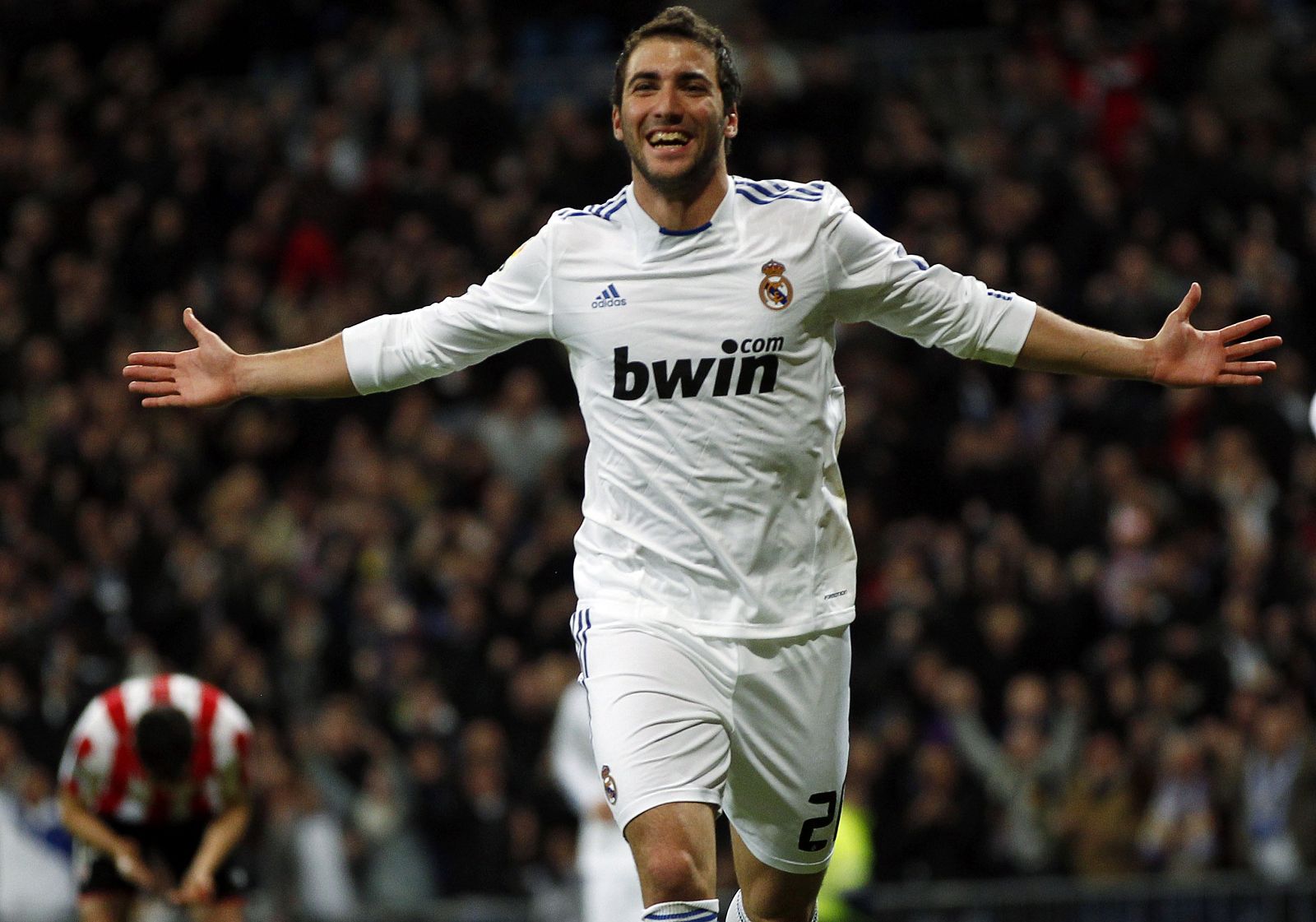 Real Madrid's Higuain celebrates after scoring a goal against Athletic BIlbao during their Spanish first division soccer match in Madrid