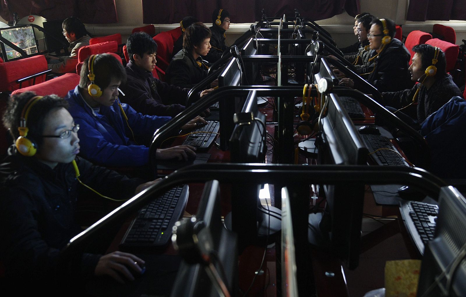 People use computers at an Internet cafe in Changzhi