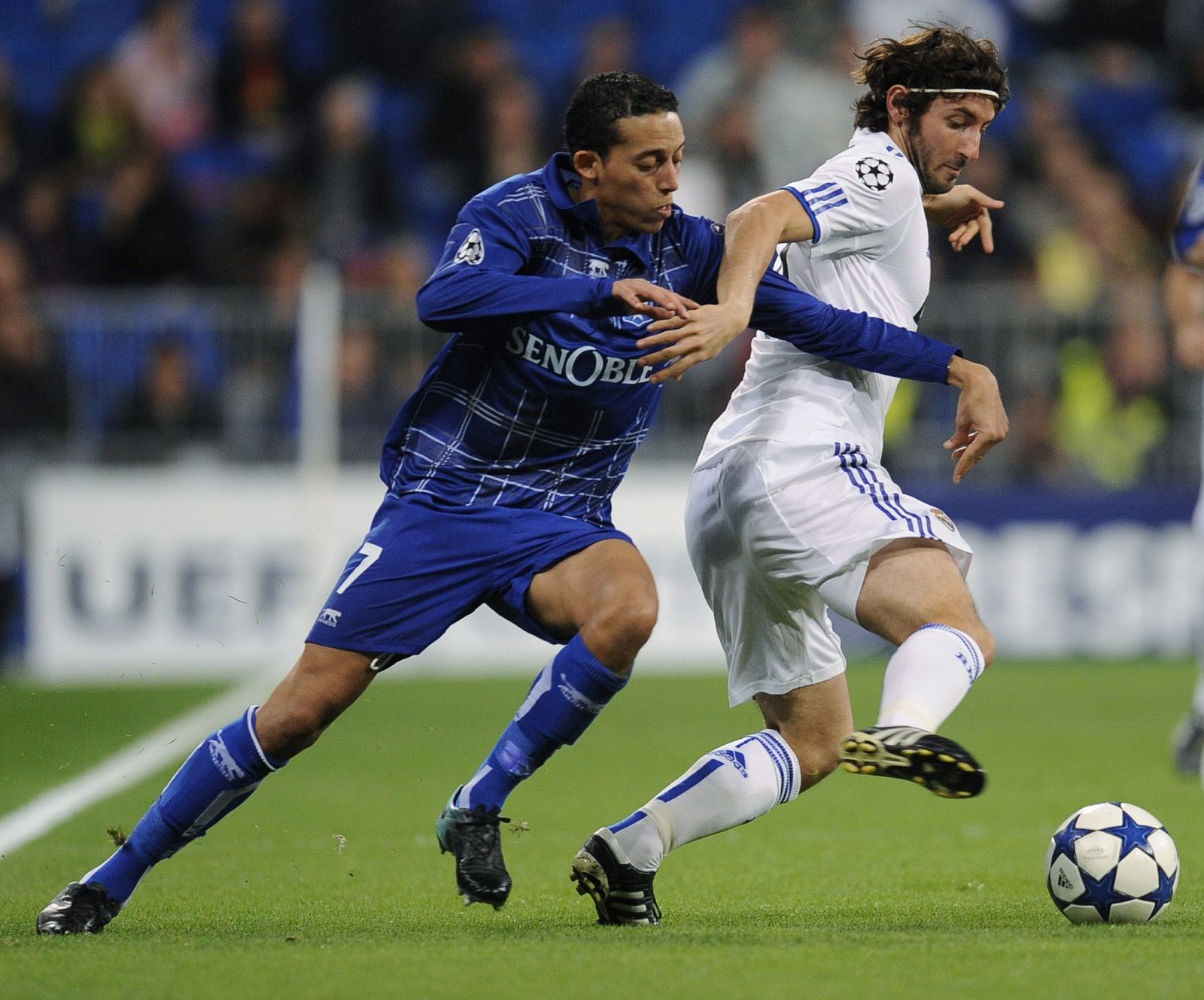 Real Madrid's Granero fights for the ball with AJ Auxerre's Chafni during their Champions League Group G soccer match in Madrid