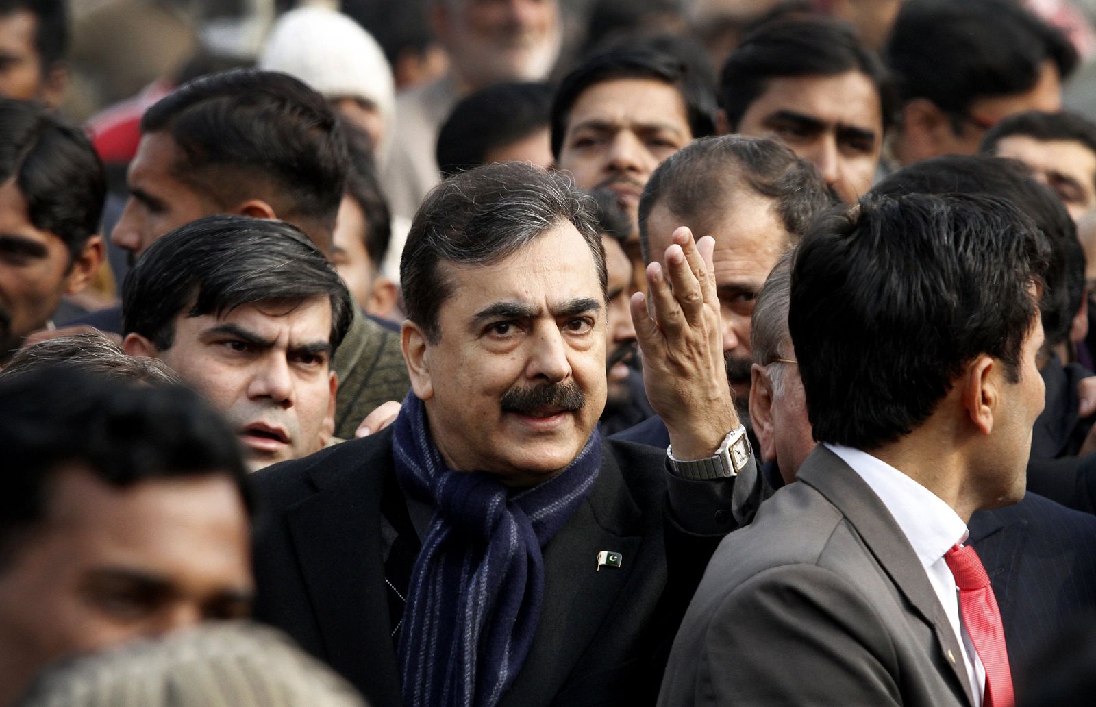 Pakistan's PM Gilani gestures while arriving to take part in funeral prayers for Punjab Governor Taseer in Lahore