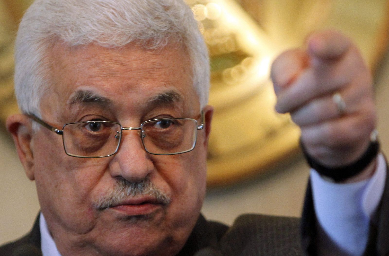 Palestinian President Mahmoud Abbas gestures during a news conference after meeting Egyptian President Hosni Mubarak at the presidential palace in Cairo