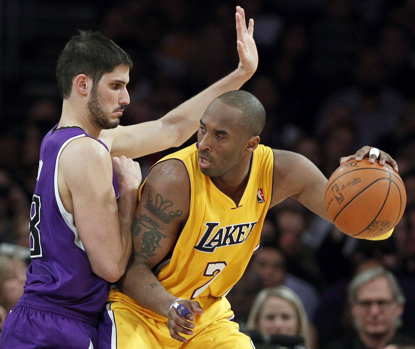 Los Angeles Lakers Kobe Bryant drives on Sacramento Kings Omri Casspi of Israel during their NBA basketball game in Los Angeles