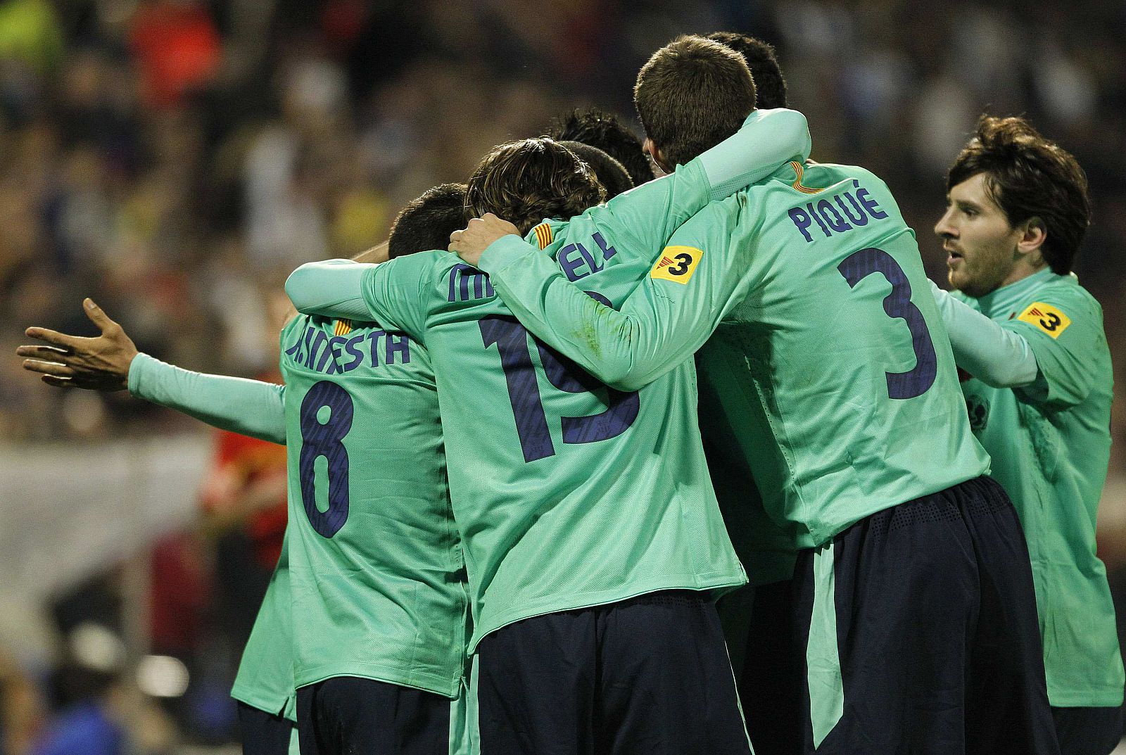 Barcelona's players celebrate after they scored against Hercules during their Spanish first division soccer match in Alicante