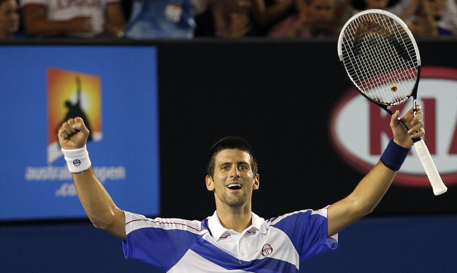 Djokovic of Serbia celebrates his victory over Murray of Britain during their men's singles final match at the Australian Open tennis tournament in Melbourne