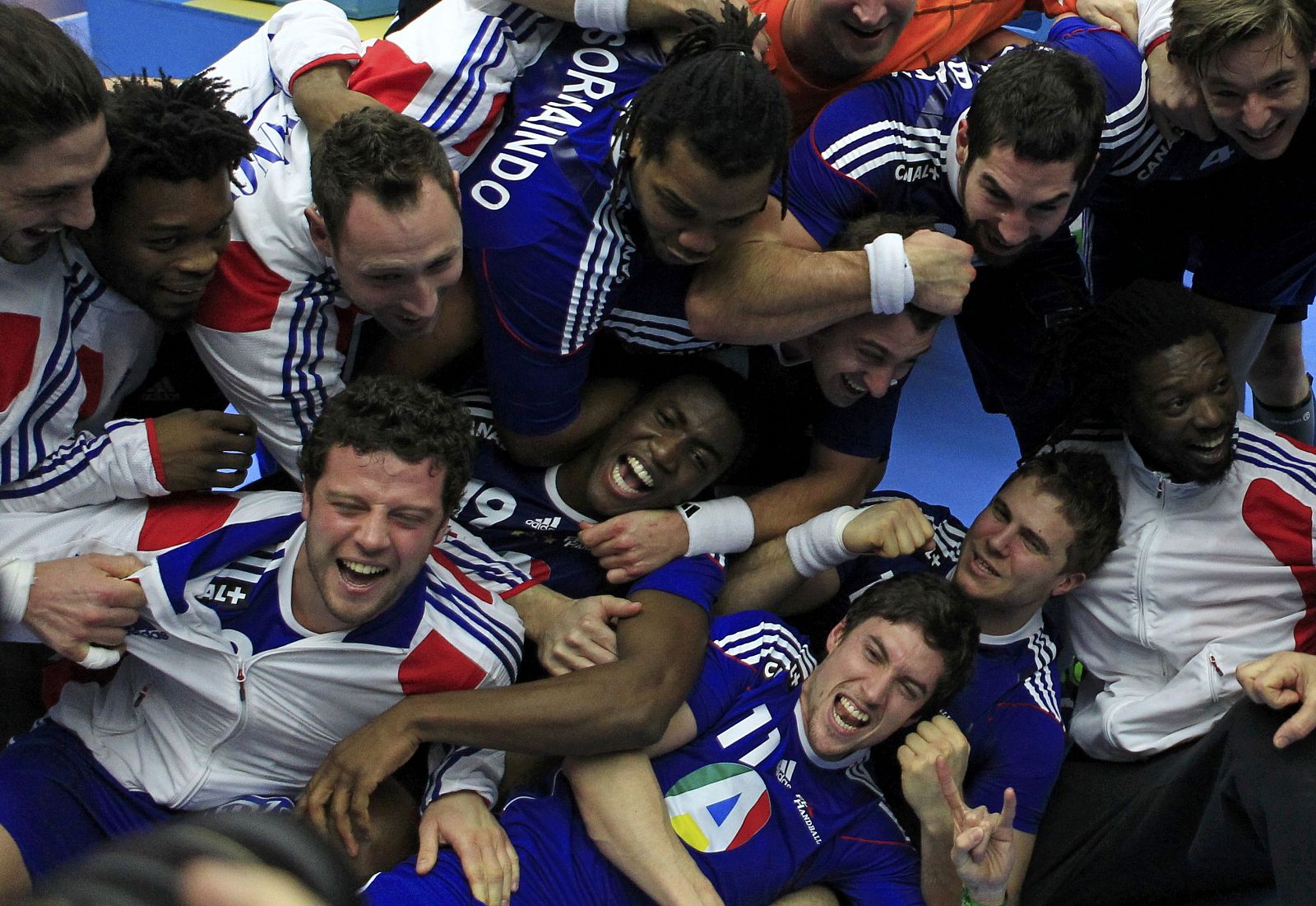 France's players celebrate winning the gold medal of the Men's Handball World Championship after defeating Denmark in the final match in Malmo
