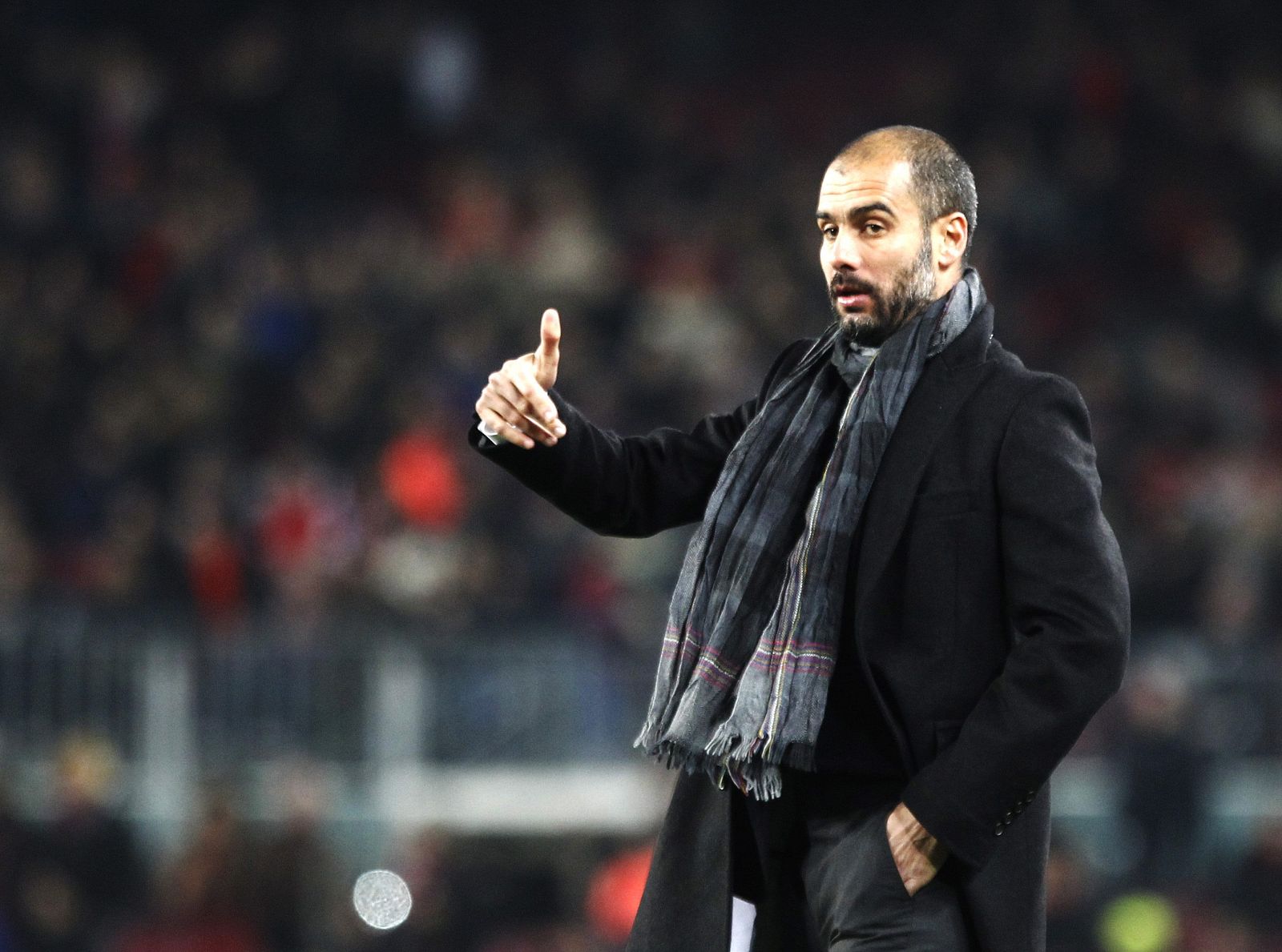 Barcelona's coach Guardiola gestures to his players in celebration of their goal against Almeria during their Spanish King's Cup soccer match in Barcelona
