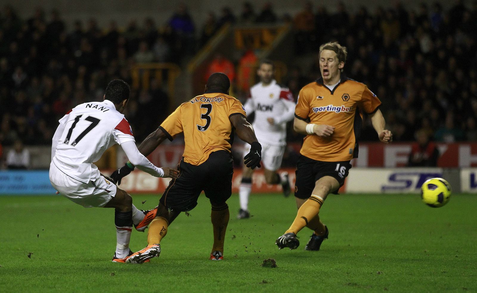 Manchester United's Nani shoots and scores his goal against Wolverhampton Wanderers during their English Premier League soccer match in Wolverhampton
