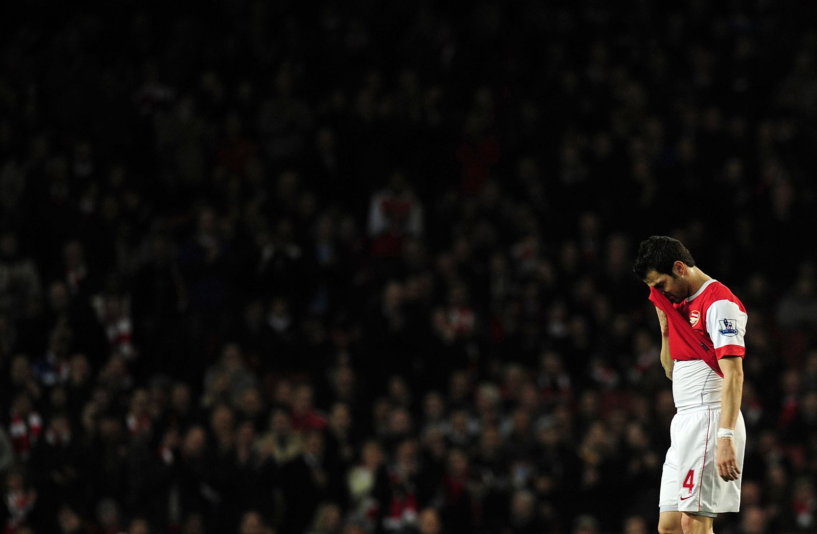 Arsenal's captain Cesc Fabregas walks off the pitch as he is substituted during their English Premier League soccer match against Stoke City at the Emirates Stadium in London