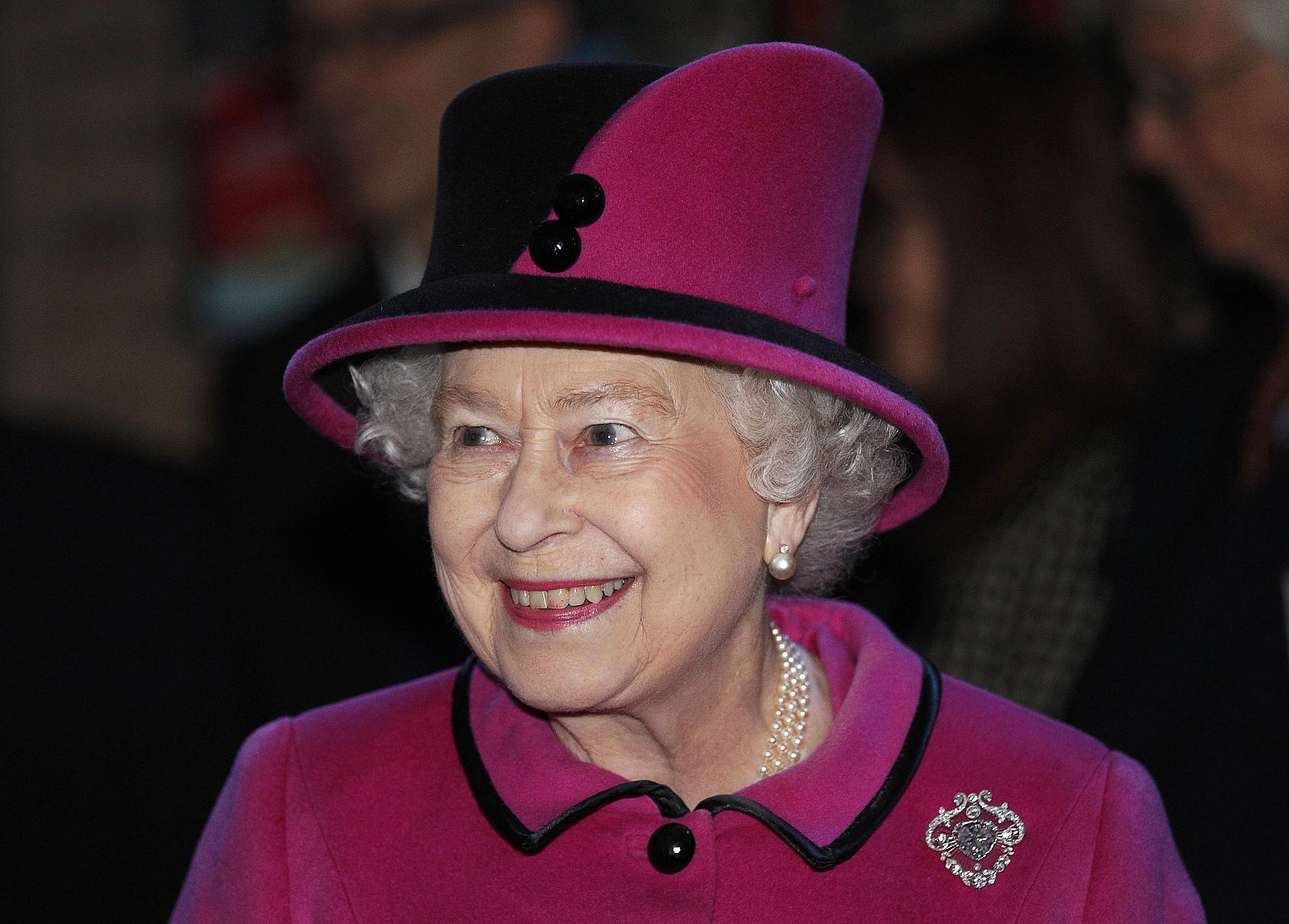 Britain's Queen Elizabeth smiles during her visit to the Royal Shakespeare Theatre in Stratford-upon-Avon