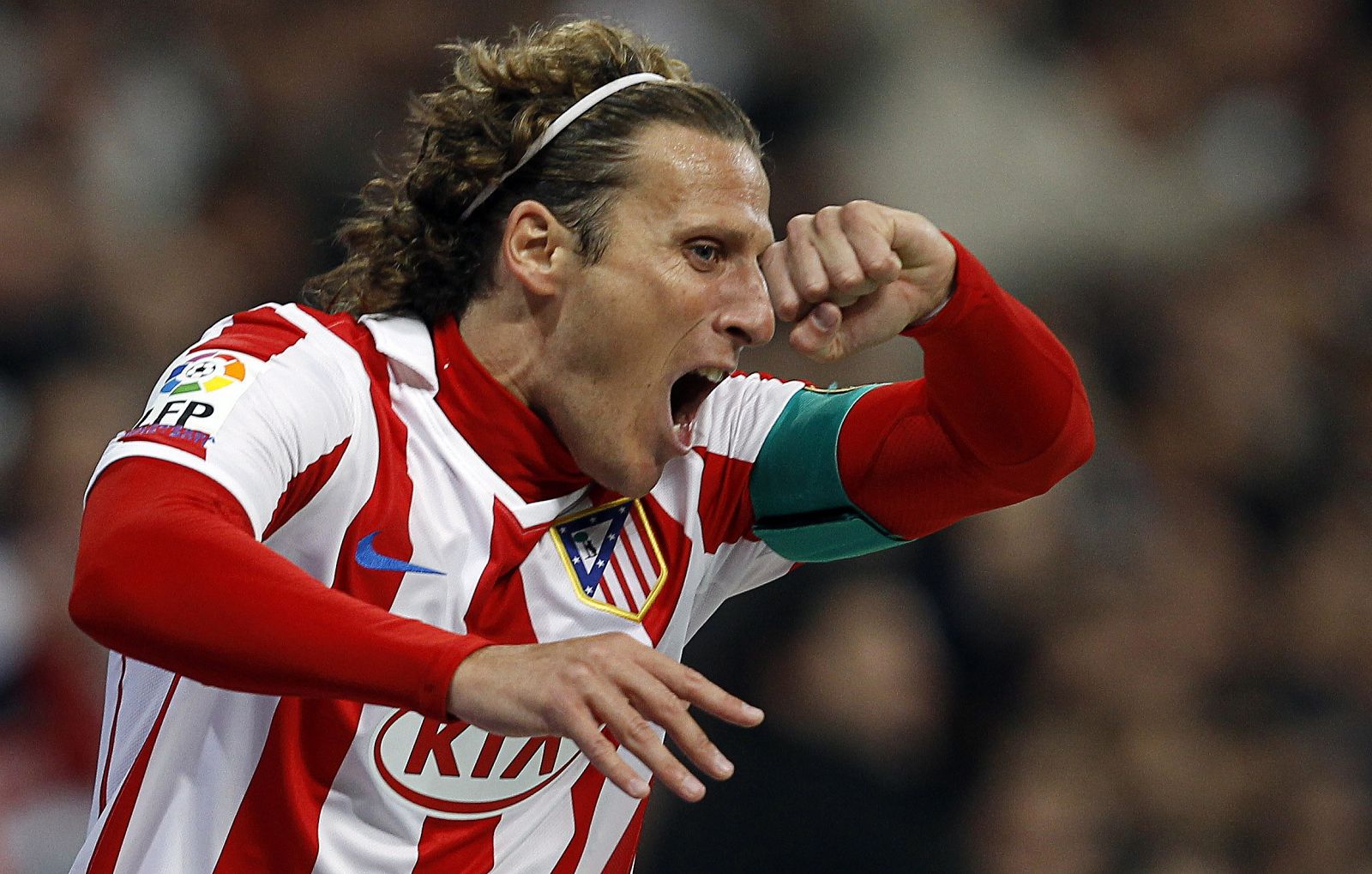 Atletico Madrid's Forlan celebrates after scoring during their Spanish Kings Cup quarter-final first leg match in Madrid