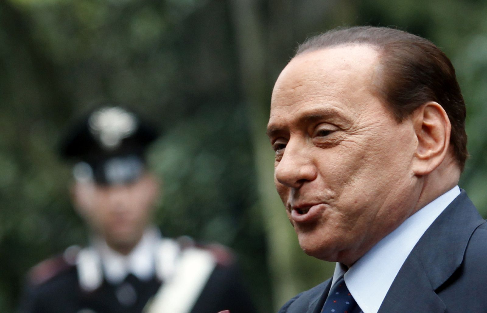 Italian Prime Minister Berlusconi arrives to attend a meeting at the Italian Embassy to the Holy See on the occasion of the 1929 Patti Lateranensi anniversary, in Rome