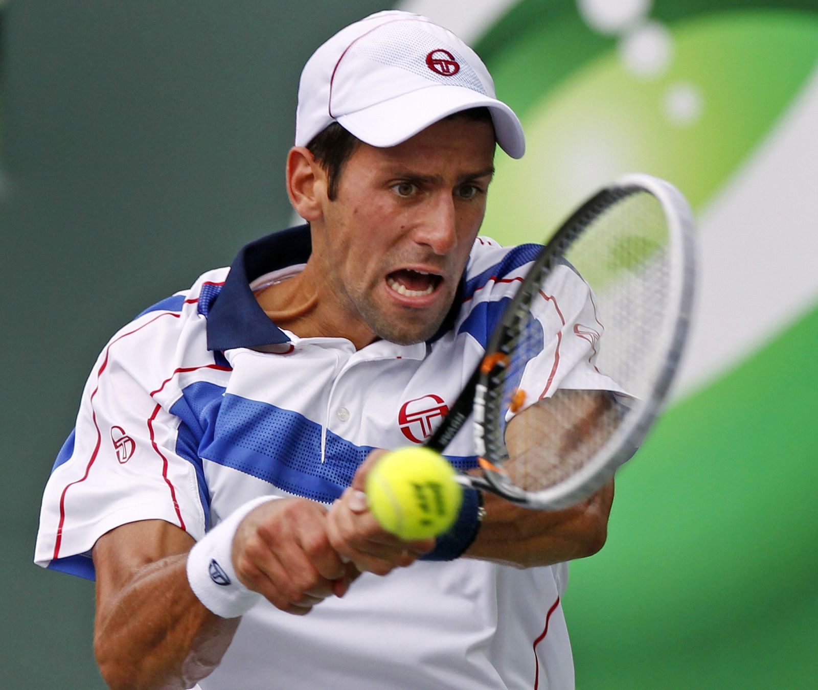 Djokovic hits a return against Fish at the Sony Ericsson Open tennis tournament in Key Biscayne