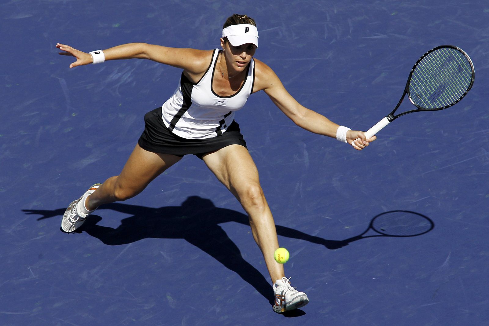 Martinez Sanchez returns a shot against Wozniacki at the Indian Wells WTA tennis tournament in Indian Wells