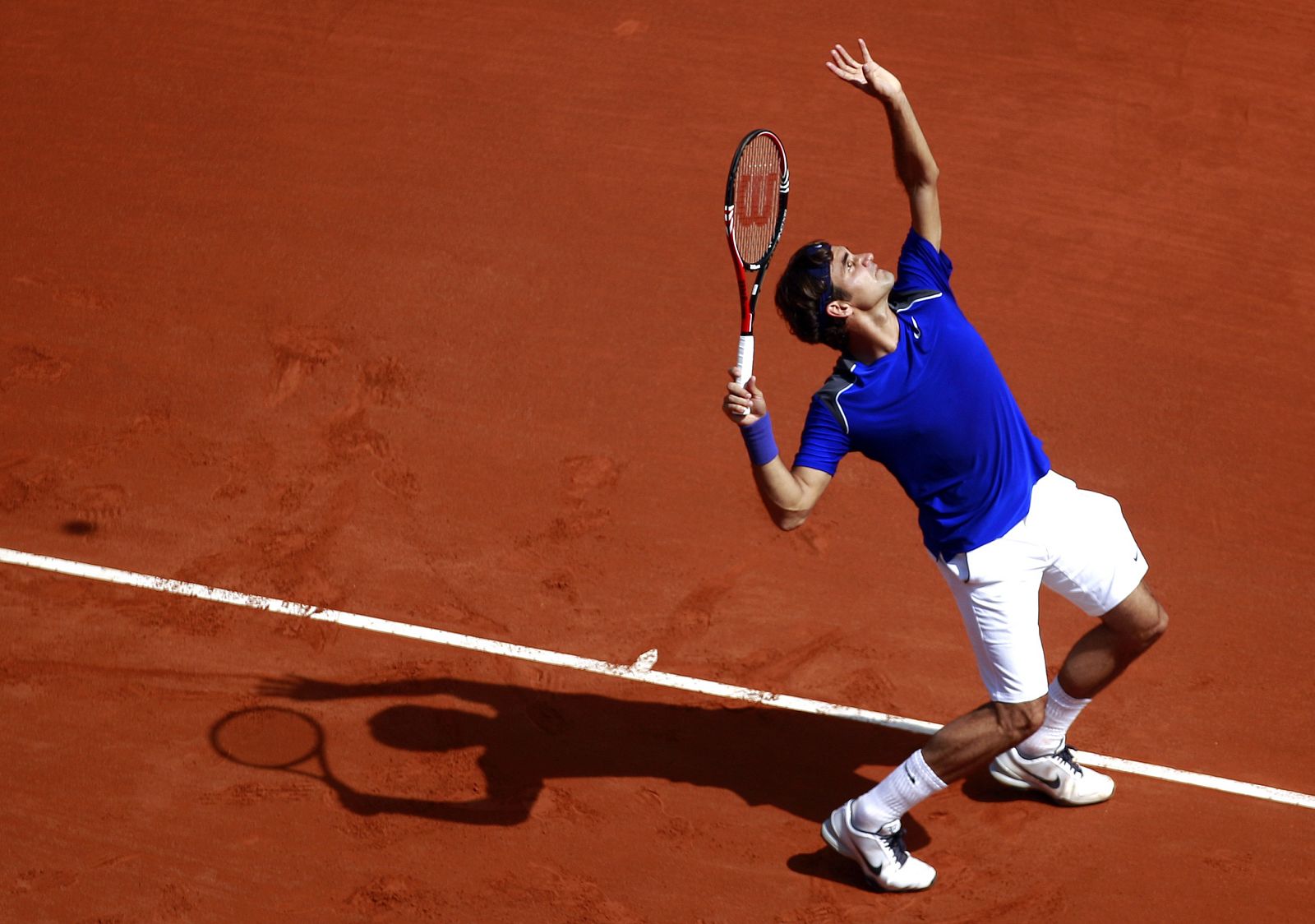 Switzerland's Federer serves to Croatia's Cilic during the Monte Carlo Masters tennis tournament in Monaco