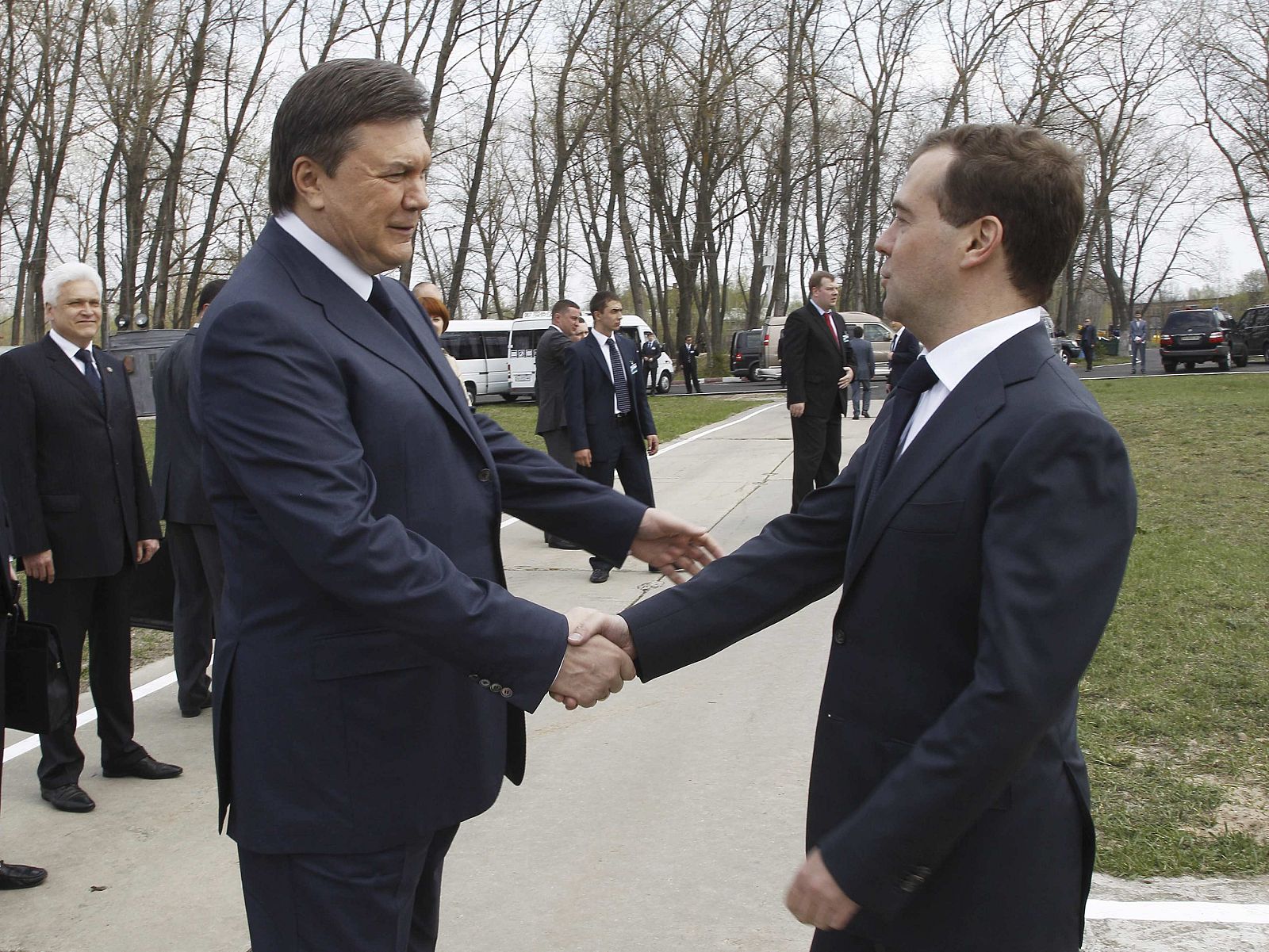 Dmitry Medvedev shakes hands with Viktor Yanukovich after arriving to attend memorial events in Chernobyl