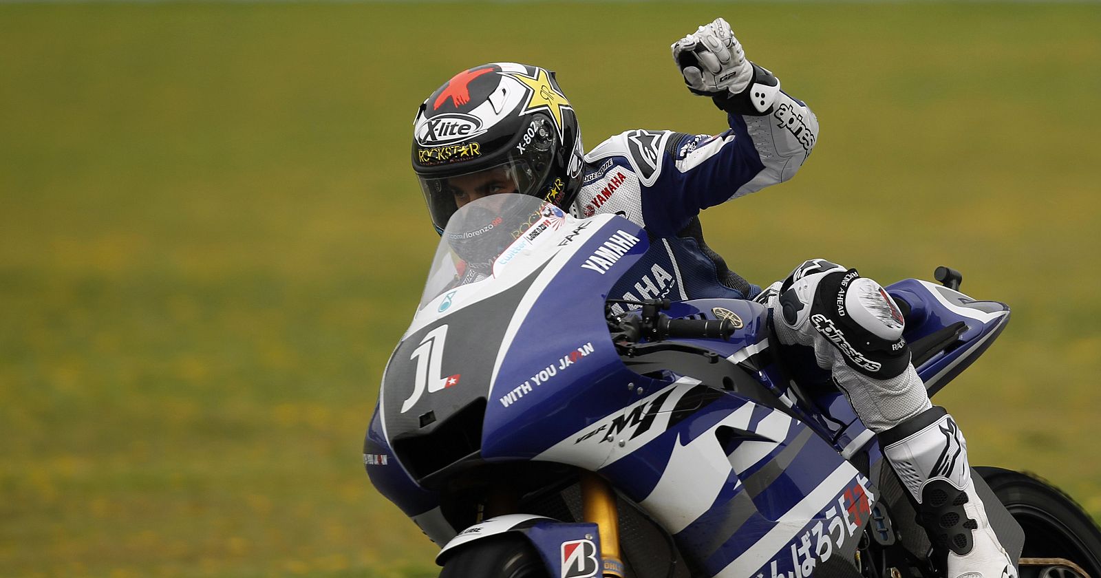 Yamaha's MotoGP rider Jorge Lorenzo of Spain greets the crowd during the last lap of the Spanish Grand Prix in Jerez