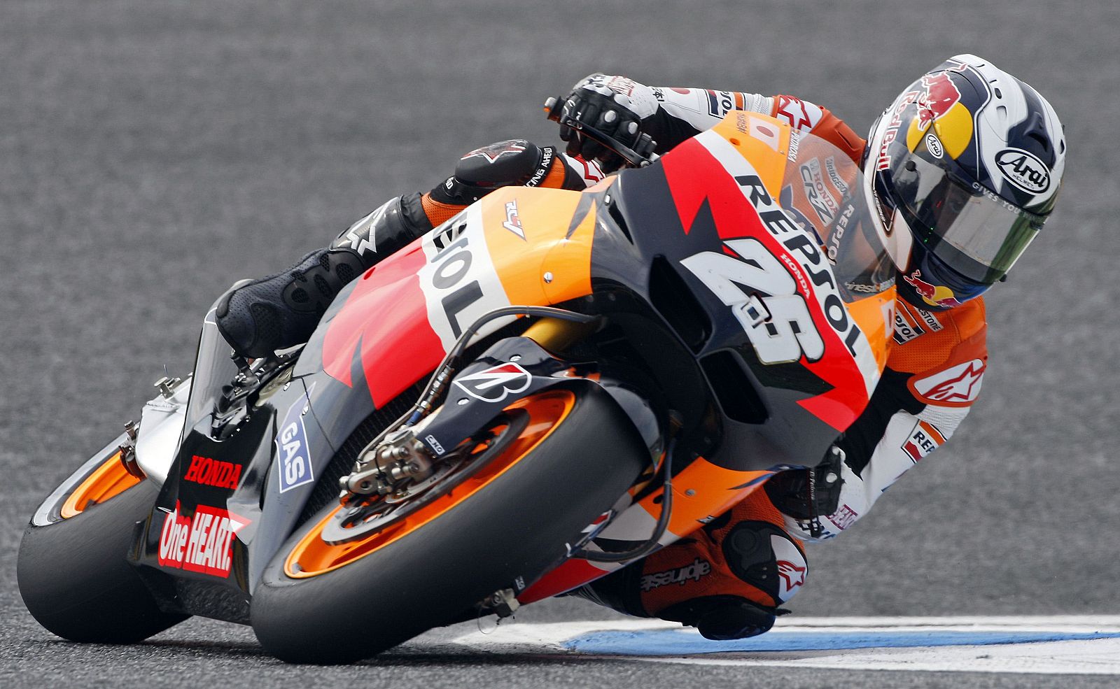 Pedrosa takes a curve on his MotoGP Honda during the first free practice session for the Portuguese Grand Prix on the Estoril track