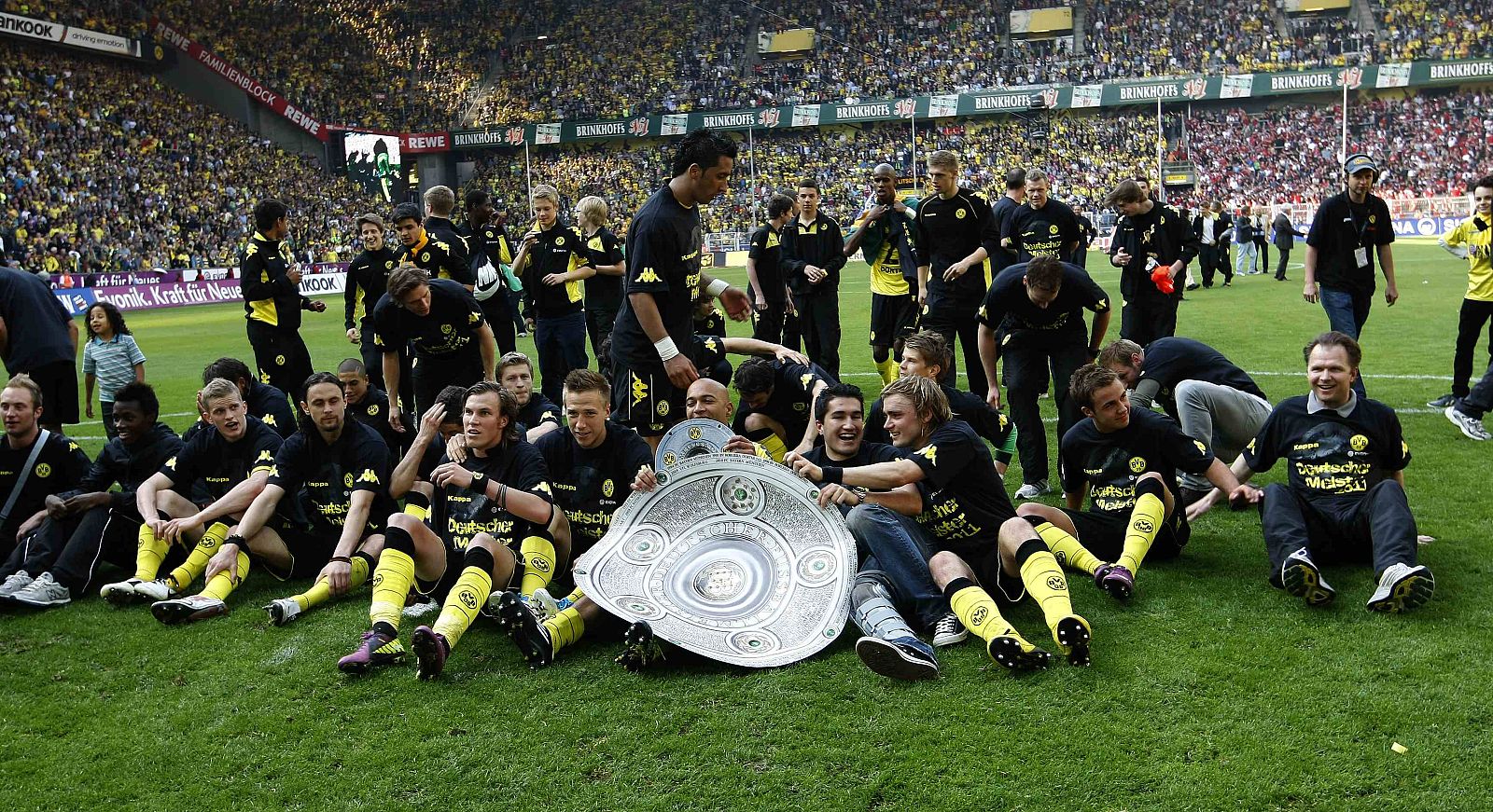 Borussia Dortmund's players celebrate the winning of the German Championship after their German Bundesliga soccer match against Nuremberg in Dortmund