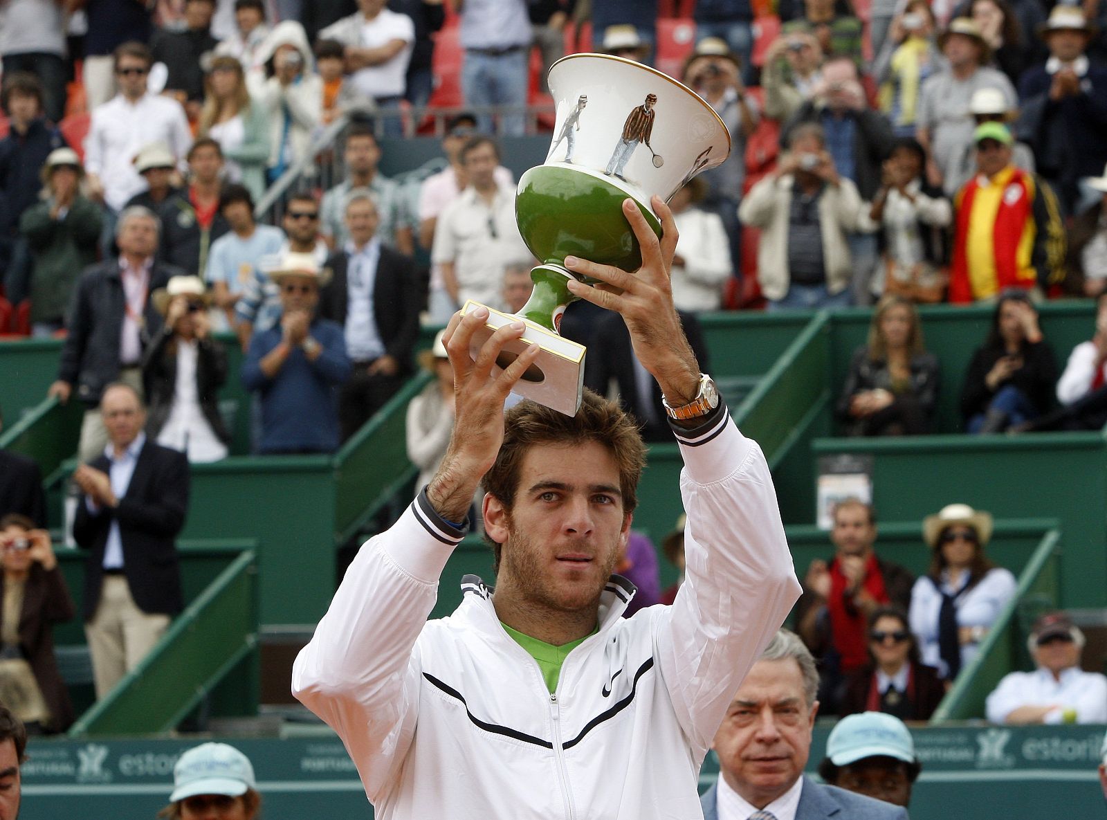 Argentine's Juan Martin del Potro holds the trophy of the Estoril Tennis Open after winning his final match against Spain's Fernando Verdasco