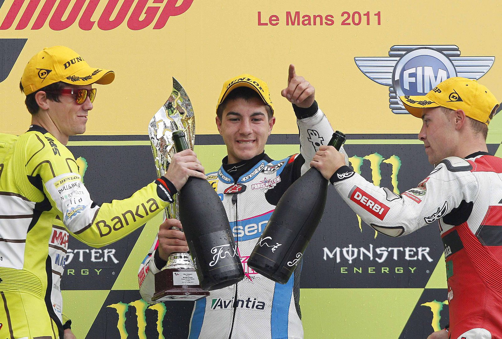 Aprilia's 125cc rider Maverick Vinales of Spain celebrates on the podium after his victory at the MotoGP French motorcycling Grand Prix at the Le Mans circuit