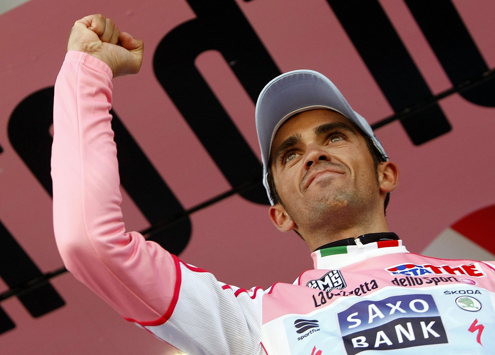 Contador of Spain wearing the leader's pink jersey celebrates on the podium after the 20th stage of the Giro d'Italia cycling race from Verbania to Sestriere