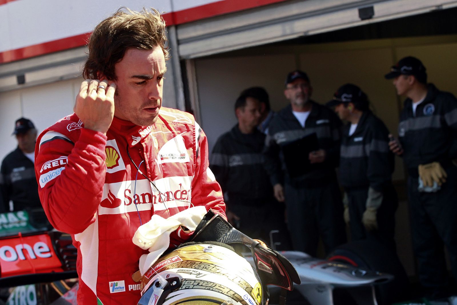 Ferrari Formula One driver Alonso of Spain leaves the pits after the qualifying session of the Monaco F1 Grand Prix