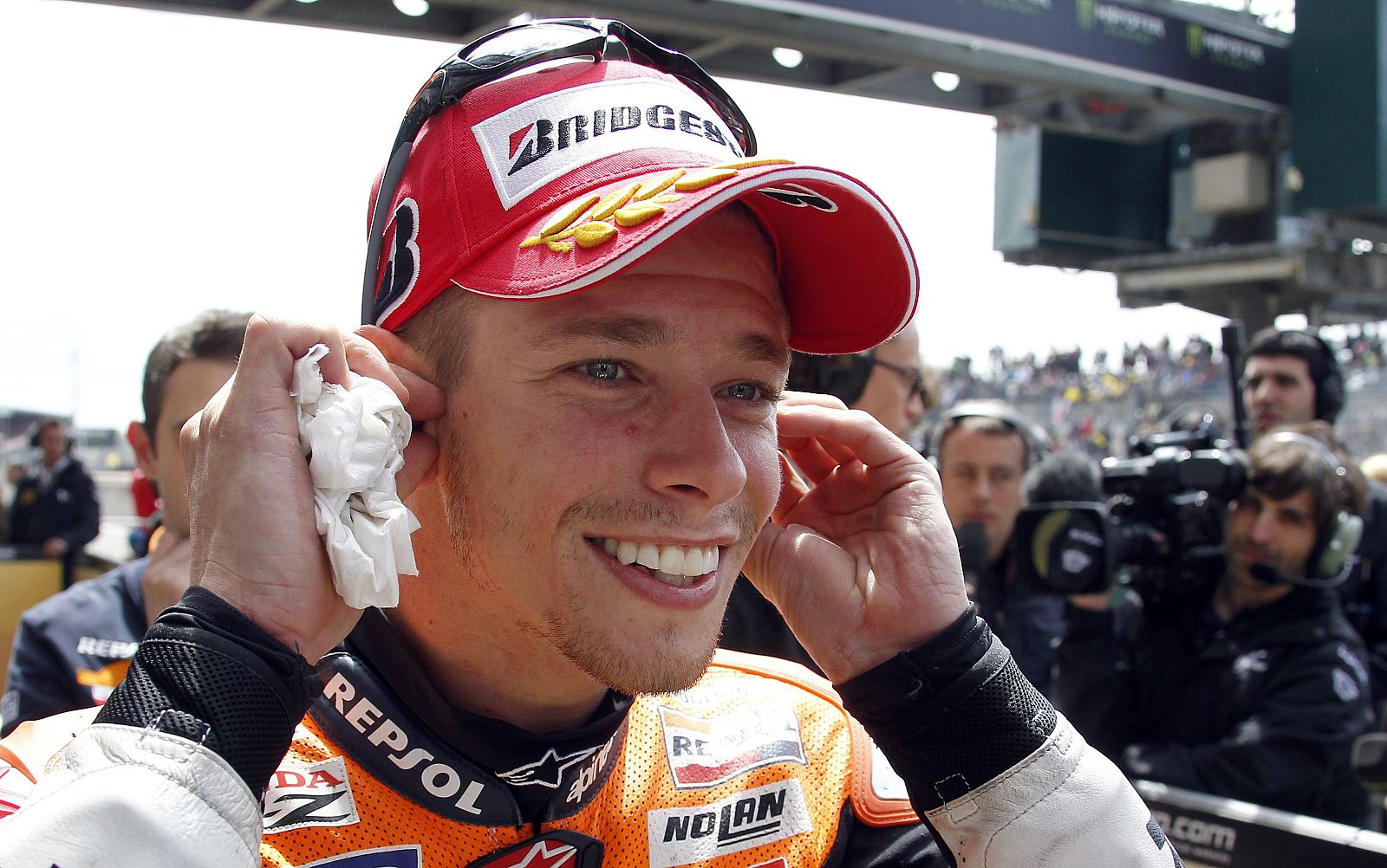 Stoner of Australia smiles as he celebrates at the MotoGP French motorcycling Grand Prix at the Le Mans circuit