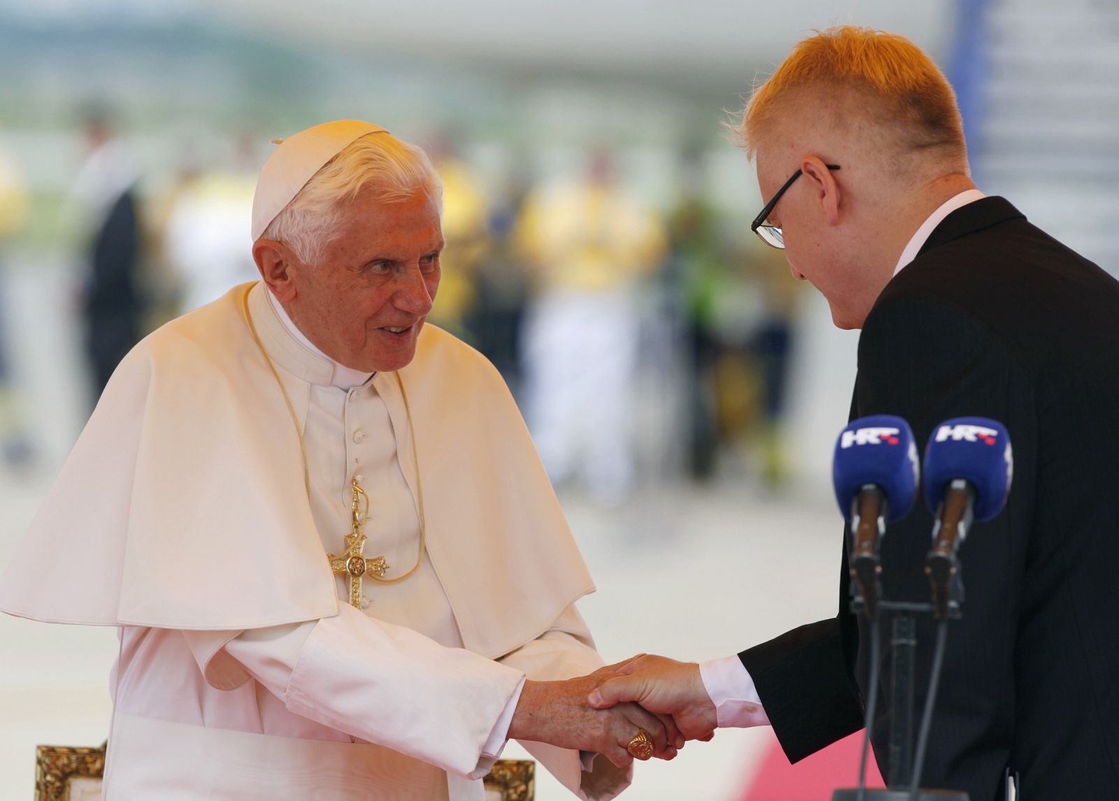 Pope Benedict XVI is greeted by Croatian President Ivo Josipovic at Pleso International Airport in Zagreb