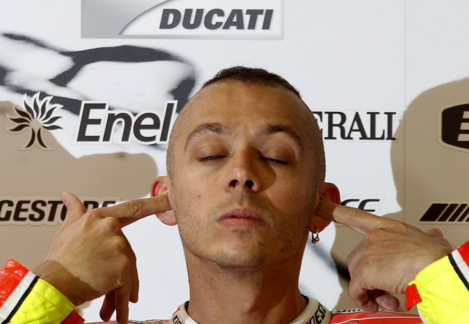 Ducati MotoGP rider Rossi gestures in his box during the first free practice of the Catalunya MotoGP Grand Prix at the Montmelo race track