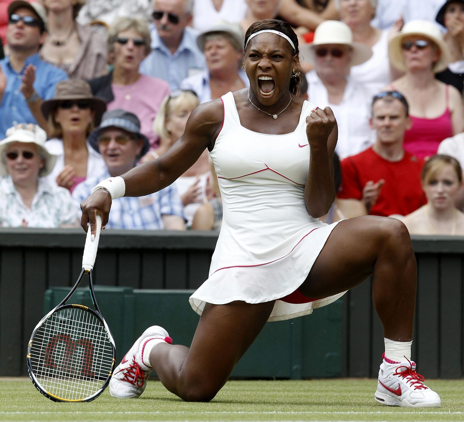 File photo of Serena Williams of the U.S. celebrating winning a point against Russia's Vera Zvonareva at the 2010 Wimbledon tennis championships in London