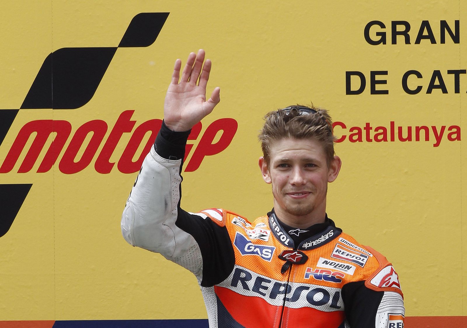 Honda MotoGP rider Casey Stoner of Australia waves on the podium after winning the Catalunya MotoGP Grand Prix at the Montmelo race track, near Barcelona