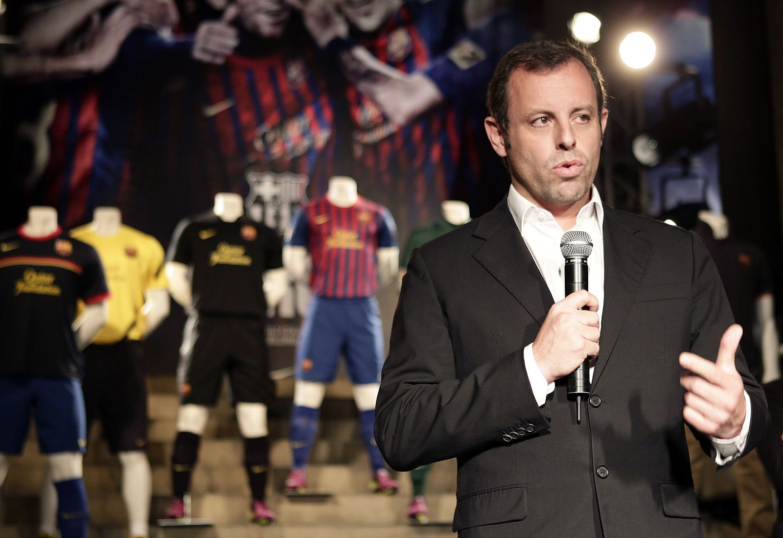 Barcelona's President Rosell speaks next to new Barcelona jerseys for 2011-2012 season with Qatar Foundation logo during presentation in Barcelona